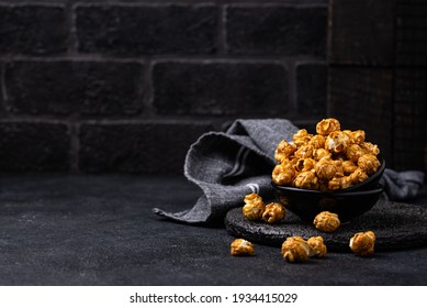 Salted Caramel Popcorn In Bowl On Dark Background