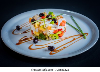 Salted Cod (bacalao) Dish, On A White Plate And Dark Background.