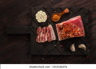Salted dried bacon with spices and bay leaves and garlic