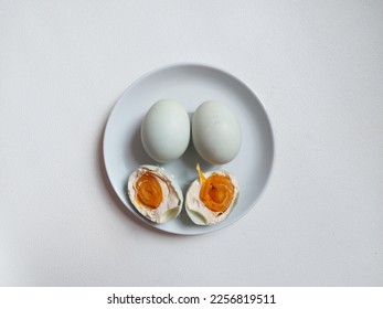 Salted Egg. It's a dish made from eggs that are preserved by salting them.  Most of the eggs that are salted are duck eggs, although it does not rule out other eggs - Shutterstock ID 2256819511