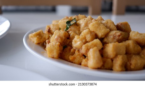 Salted Egg Sauce  Fried Tofu On A White Plate.