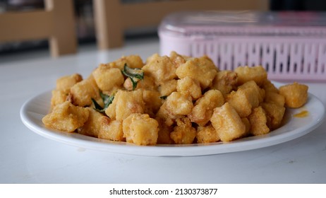 Salted Egg Sauce  Fried Tofu On A White Plate.