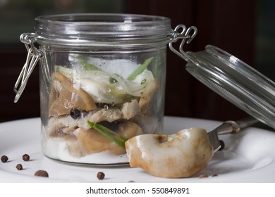 Salted Milk Mushrooms In A Glass Jar With Cream Sauce