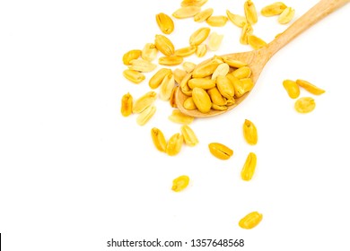 Salted peanuts on wooden spoon isolated on white background. - Shutterstock ID 1357648568