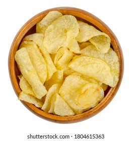 Salted Potato Chips With Peel, Also Crisps, In Wooden Bowl. Thin Slices Of Potato, Deep Fried In Oil Until Crunchy. Served As Snack, Side Dish Or Appetizer. Close-up From Above Over White, Food Photo.