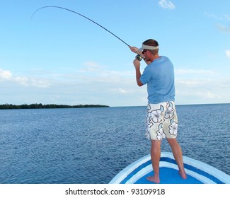 Saltwater Fly Fishing For Bonefish - Fighting A Big Fish In The Ocean Off The Front Of A Boat