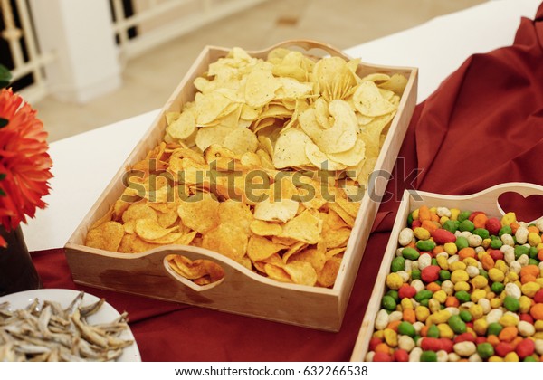 Salty Chips Nuts On Wooden Desk Stock Photo Edit Now 632266538