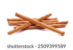 Salty cracker pretzel sticks, stuffed with peanuts, crumbs isolated on white