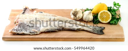 Salty dry fish with garlic,lemon and parsley.