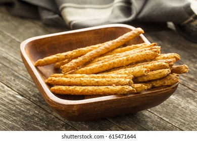 Salty Pretzel Sticks In Wooden Bowl.