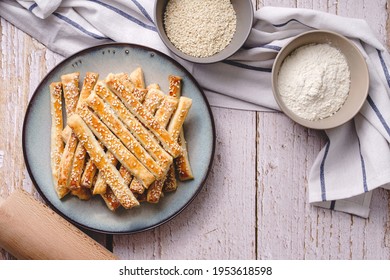 salty sesame bread sticks traditional homemade baked snacks on the table - close up top view healthy vegan or vegetarian food concept copy space