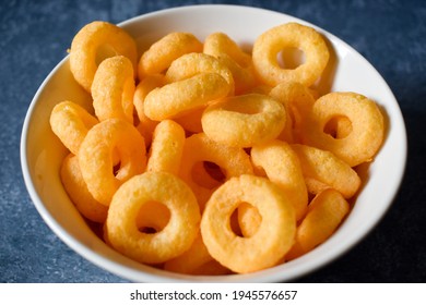 Salty Snack With Cheese In A Bowl On A Blue Table