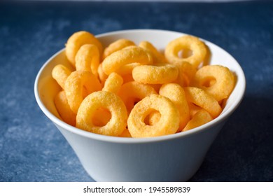 Salty Snack With Cheese In A Bowl On A Blue Table