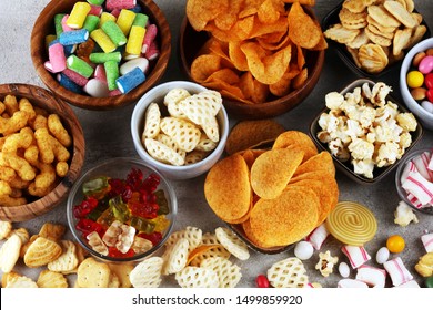Salty snacks. Pretzels, chips, crackers and candy sweets. Unhealthy products. food bad for figure, skin, heart and teeth. Assortment of fast carbohydrates food. 