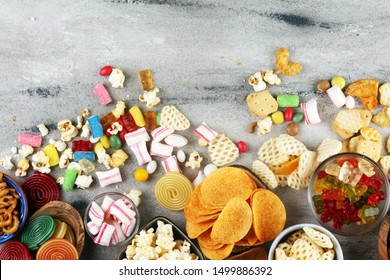 Salty snacks. Pretzels, chips, crackers and candy sweets. Unhealthy products. food bad for figure, skin, heart and teeth. Assortment of fast carbohydrates food. 
