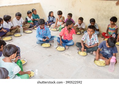 SALUNKWADI, INDIA - July 11, 2015: School Children Having Mid Day Meal In Rural Village Salunkwadi, Ambajogai, Beed, Maharashtra, India, South East Asia.