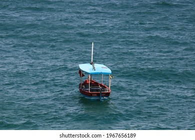 Salvador, Bahia, Brazil - 05 02 2021: a small fishing boat alone in the middle of the sea