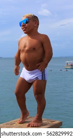 SALVADOR, BAHIA, BRAZIL - DEC 18, 2016: Celebrity midget posing on Porto da Barra Beach