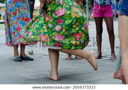 Salvador, Bahia, Brazil - December 06, 2015: Women dancing the traditional samba de roda of Bahia with colorful clothes. Salvador, Bahia, Brazil.