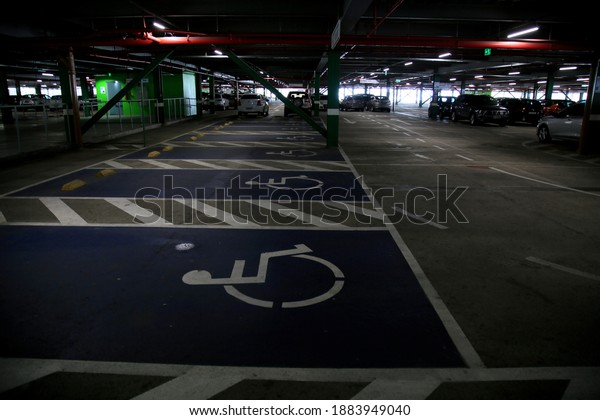 salvador, bahia, brazil - december 23,\
2020: Reserved area for wheelchair users in a parking space at the\
international airport of the city of Salvador.\
