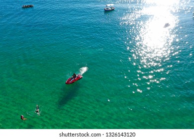 SALVADOR, BAHIA, BRAZIL - FEB 26, 2019: Porto Da Barra Beach, People Swimming On A Beautiful Emerald Green Water. 