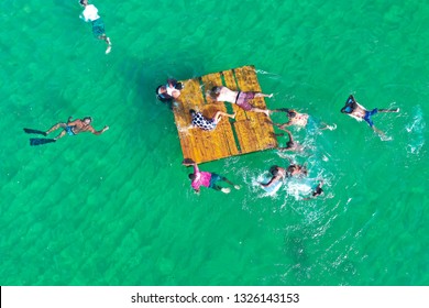 SALVADOR, BAHIA, BRAZIL - FEB 26, 2019: Porto Da Barra Beach, People Swimming On A Beautiful Emerald Green Water. 