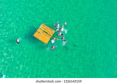 SALVADOR, BAHIA, BRAZIL - FEB 26, 2019: Porto Da Barra Beach, People Swimming On A Beautiful Emerald Green Water. 