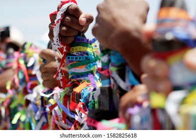 SALVADOR, BAHIA / BRAZIL - January 15, 2015: Candomble fans and devotees of Senhor do Bonfim accompany the traditional washing of the stairs of the Bonfim Church in Salvador. 