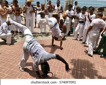 SALVADOR, BAHIA, BRAZIL - January  31, 2016:  Brazilian capoeira group performs for a crowd in Barra neighborhood. 