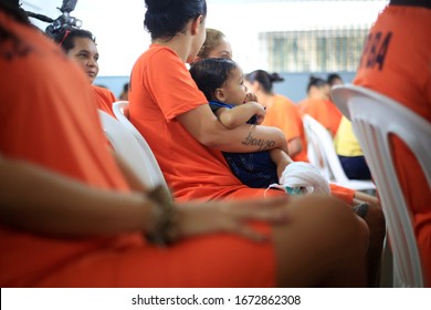 Salvador, Bahia / Brazil - July 25, 2016: Inmate Of The Female Presidio Of Salvador Holds Her Son During An Event In The Prison Unit.