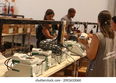 salvador, bahia, brazil - october 17, 2018: employee of the Regional Electoral Court of Bahia works in the procedure for loading and sealing electronic voting machines for elections in Salvador.