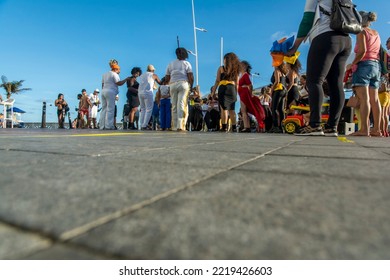 Salvador, Bahia, Brazil - October 22, 2022: Low View Of People Performing Street Dance With Capoeira At Farol Da Barra Square In Salvador, Brazil.