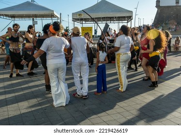 Salvador, Bahia, Brazil - October 22, 2022: People Perform Street Dance With Capoeira At Farol Da Barra Square In Salvador, Brazil.