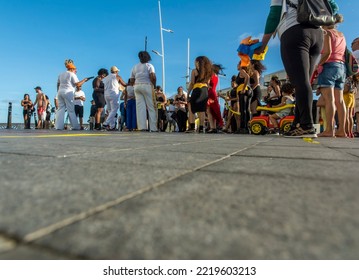 Salvador, Bahia, Brazil - October 22, 2022: Low View Of People Performing Street Dance With Capoeira At Farol Da Barra Square In Salvador, Brazil.