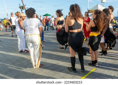 Salvador, Bahia, Brazil - October 22, 2022: People Performing Street Dance With Samba And Capoeira At Farol Da Barra Square In Salvador, Brazil.