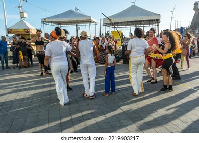 Salvador, Bahia, Brazil - October 22, 2022: People Perform Street Dance With Capoeira At Farol Da Barra Square In Salvador, Brazil.