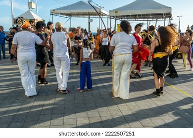 Salvador, Bahia, Brazil - October 22, 2022: People Perform Street Dance With Capoeira At Farol Da Barra Square In Salvador, Brazil.