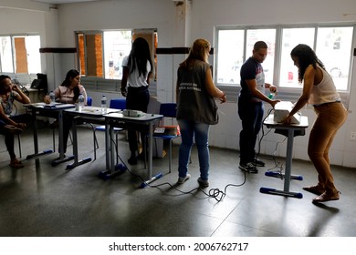 salvador, bahia, brazil - october 7, 2018: Voters are seen exchanging defective electronic voting machines at a polling station during elections in the city of Salvador. 