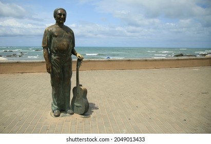 Salvador, Bahia, Brazil - September 25, 2021: Statue Of Singer Dorival Caymmi Is Seen On Itapua Beach In Salvador City.