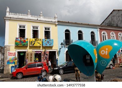 Salvador, Bahia/Brazil-29/5/2014: Crowded Street In The Old Town Of Salvador With Green Phone Booths In The Foreground.