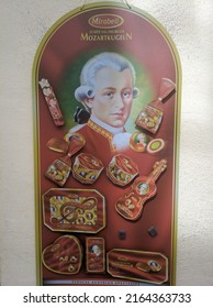 Salzburg, Austria - August 26, 2019: The Famous Composer Mozart Is Featured On A Poster Outside A Candy Store. Vertical.