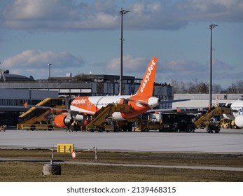 Salzburg, Austria - February 5 2022: EasyJet Airbus plane parked at Salzburg Airport (SZG) tarmac during the winter ski season