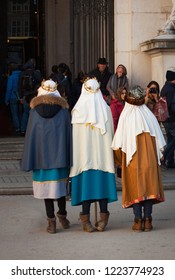 Salzburg,  Austria - January 05, 2018. Epiphany. Three Kings Day : Children On Backs With Tired Feet Depicting The Three Wise Men. Tradition Of Austrian Christmas Celebrations.