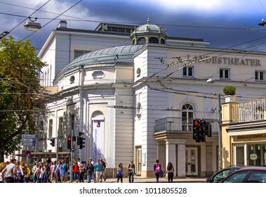 Salzburg, Austria - July 15, 2017: Group Of Tourists Near State Theater ( Salzburger Landestheater), Home To Opera, Theatre, Dance And Theatre For Young Audiences, At Cloudy Summer Day