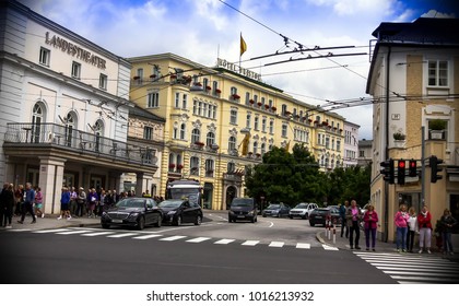 Salzburg, Austria - July 15, 2017: Group Of Tourists Near State Theater ( Salzburger Landestheater), Home To Opera, Theatre, Dance And Theatre For Young Audiences, At Cloudy Summer Day