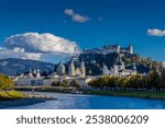 Salzburg city in Austria. Churches, castle, bridge and beautiful cityscape with the mountains on the background. Salzburg famous city sights and tourist attraction 