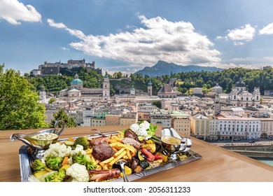 Salzburg City With Gastronomic Experience Of Typical Austrian Food Against Downtown In Austria