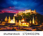 Salzburg city shining in the lights at night. Location place Festung Hohensalzburg, Salzburger Land, Austria, Europe. Photo of popular tourist attraction of the world. Discover the beauty of earth.