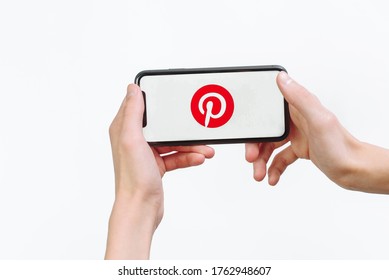 Samara Russia - 04.05.2020: A Man Holds An IPhone 11 In His Hand With The Pinterest App On A White Isolated Background