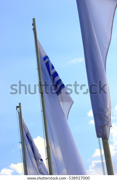 Samara, Russia - August\
20, 2016. festive white flags car manufacturer Volkswagen developed\
in the wind